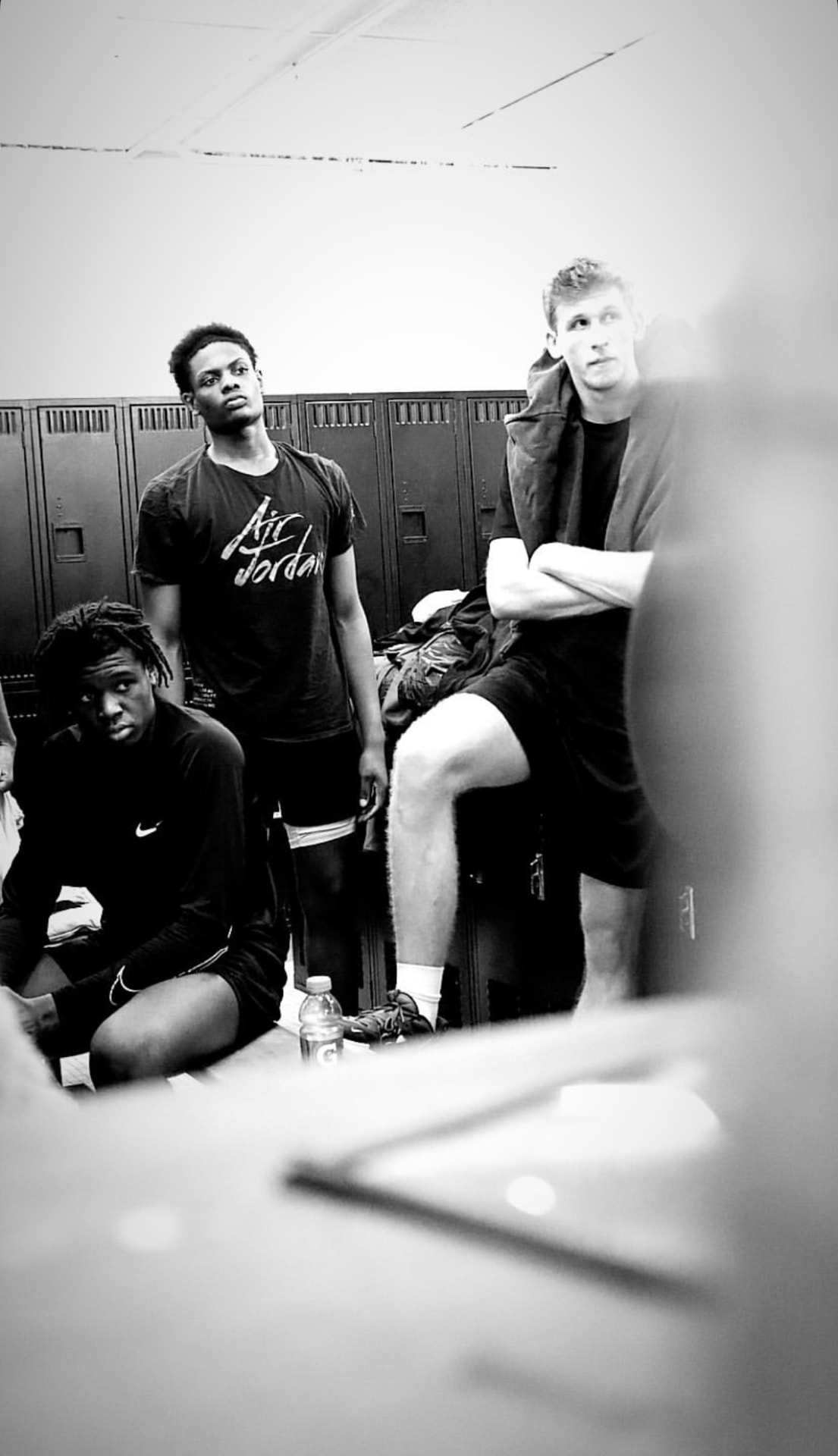 Black and white locker room moment before tip-off